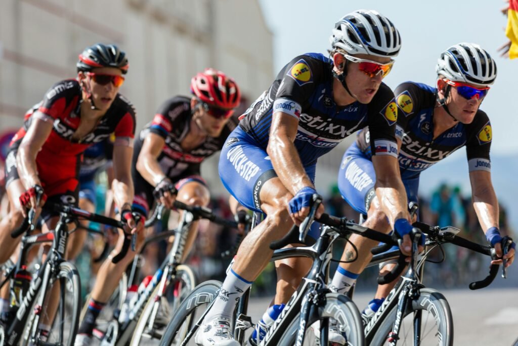 Competitive cyclists in a high-speed race, showcasing athleticism and teamwork.